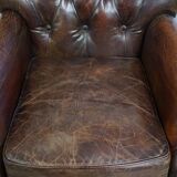 Classic grained cognac colored cowhide leather Chesterfield armchair