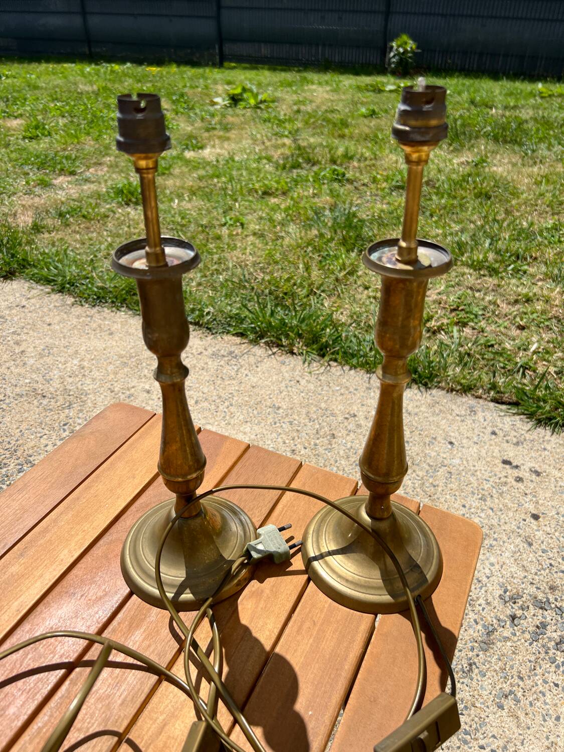 Two brass bedside lamps
