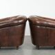 Set of two sheepskin club armchairs with fixed seat cushions