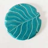 Ceramic trivet and bottle coaster from the 1950s.