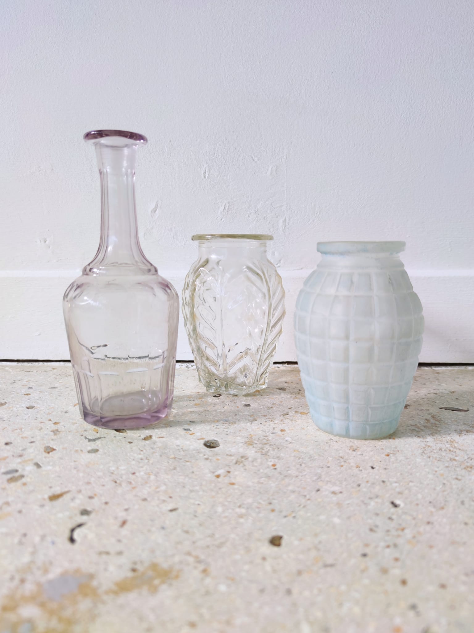 Small transparent molded glass vase