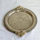 Vintage silver-plated serving tray with bow handles.