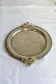 Vintage silver-plated serving tray with bow handles.