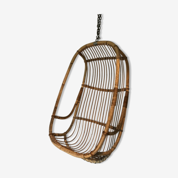 Vintage chair suspended in rattan