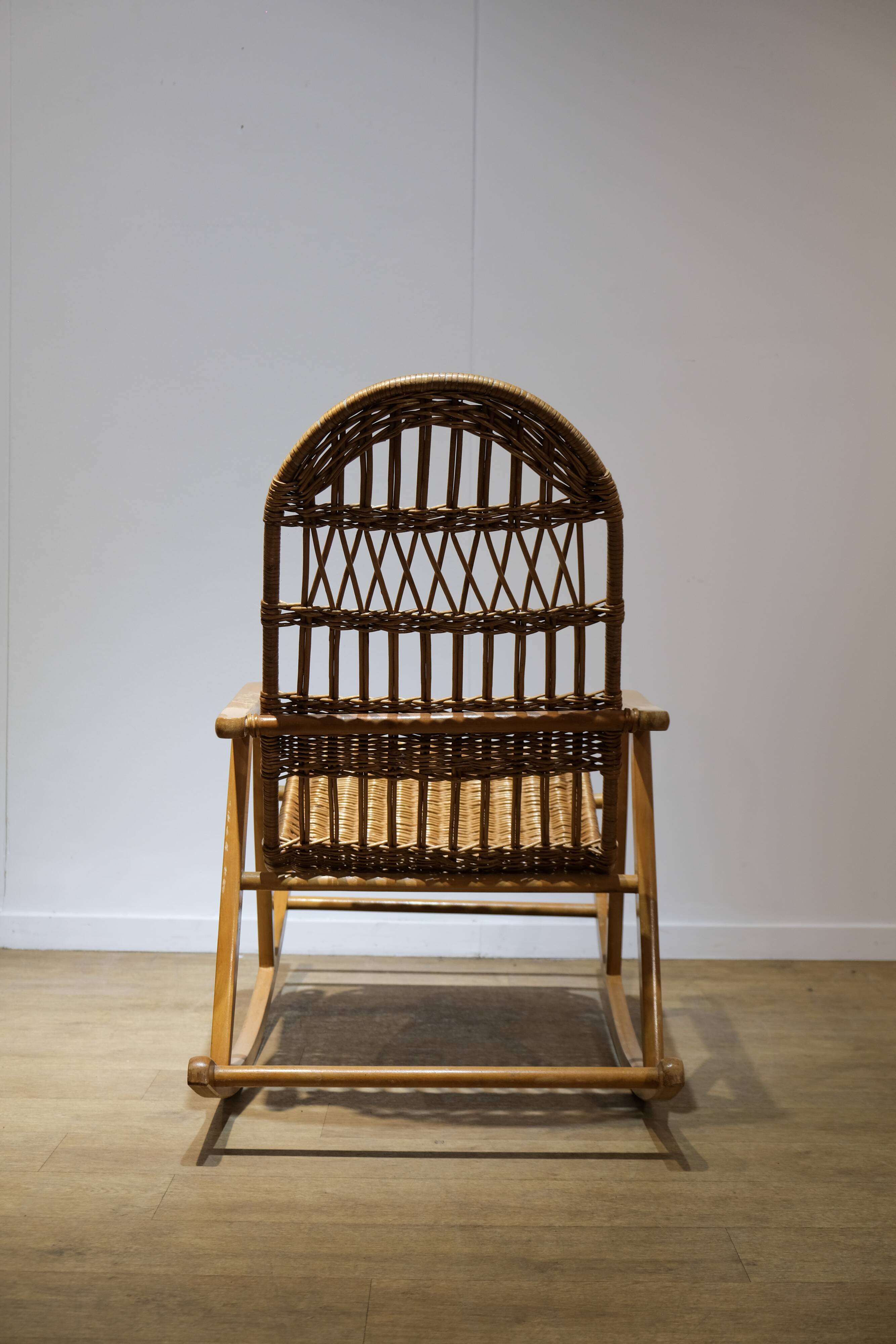 Wicker and wood rocking chair