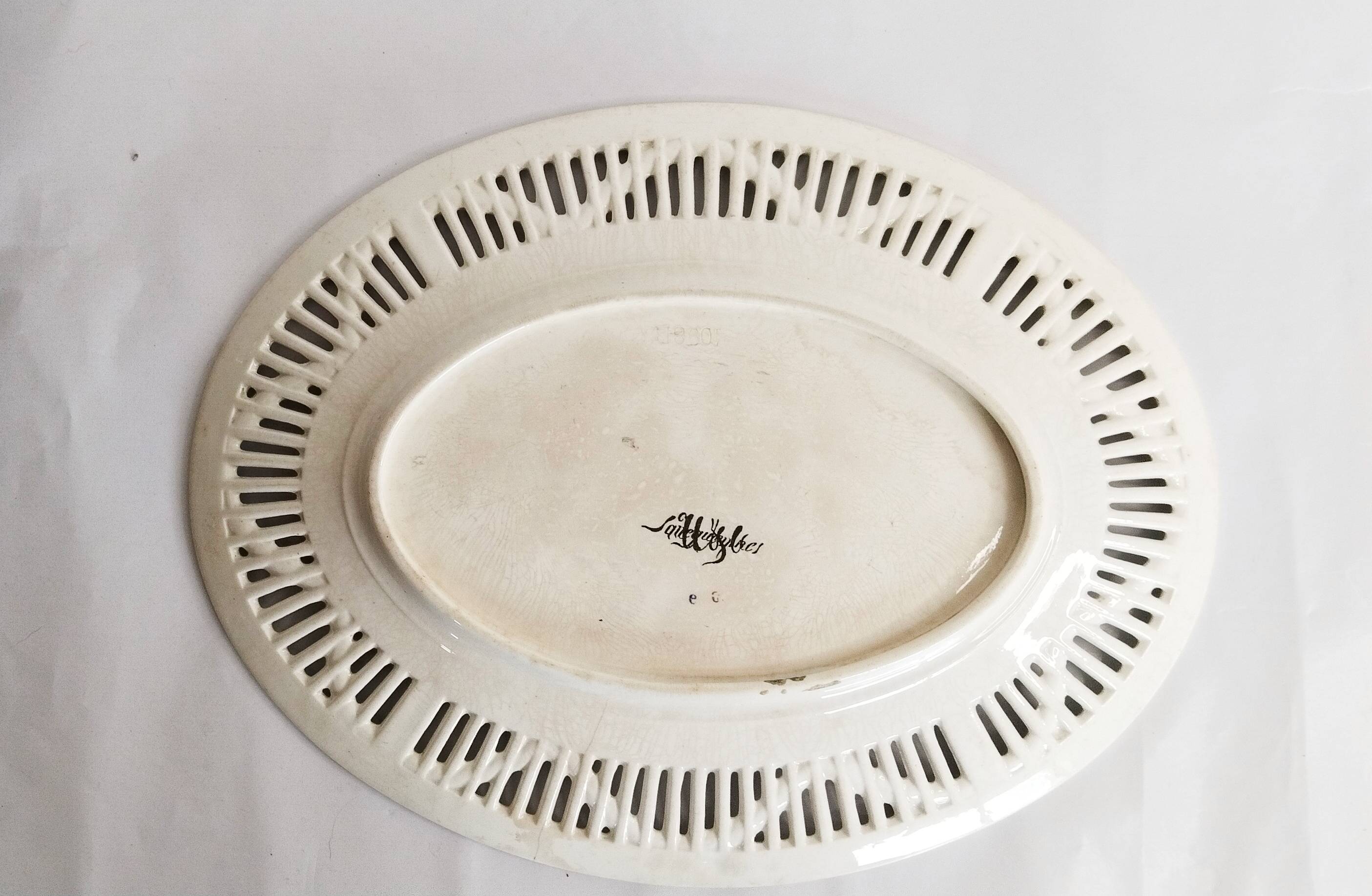 Oval dish in openwork earthenware from Sarreguemines, blue ribbon and fruit