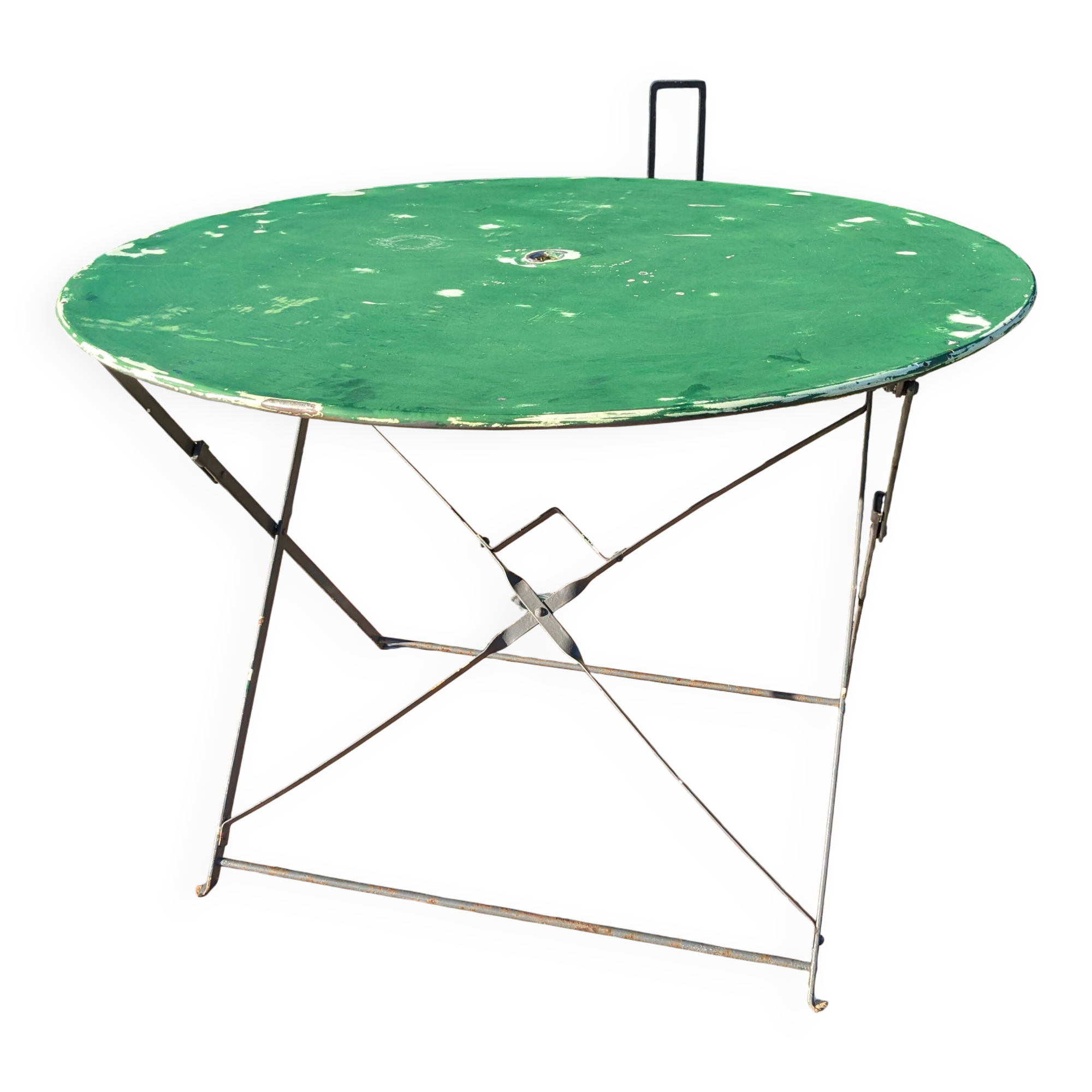 Antique round folding garden table with a green patina.