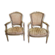 Paire de fauteuils en bois dore style Louis XVl