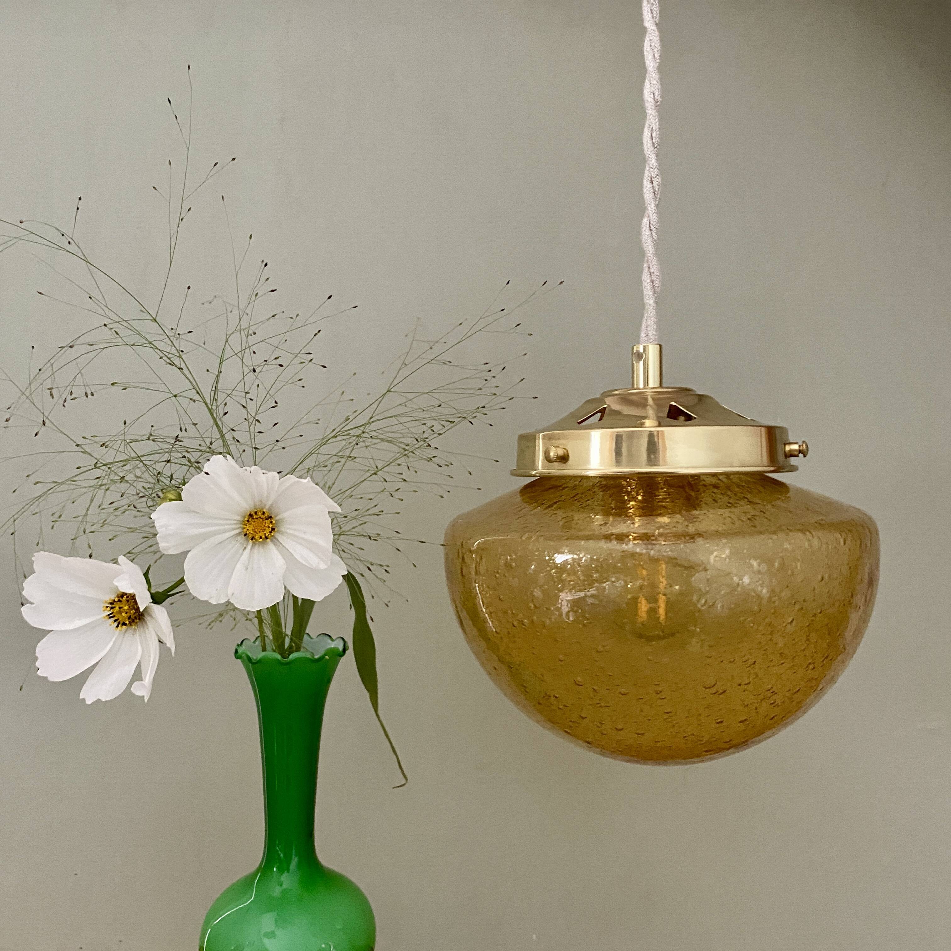 Vintage globe pendant light in bubbled amber glass