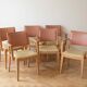 Set of 6 vintage Scandinavian chairs in wood and faux leather.
