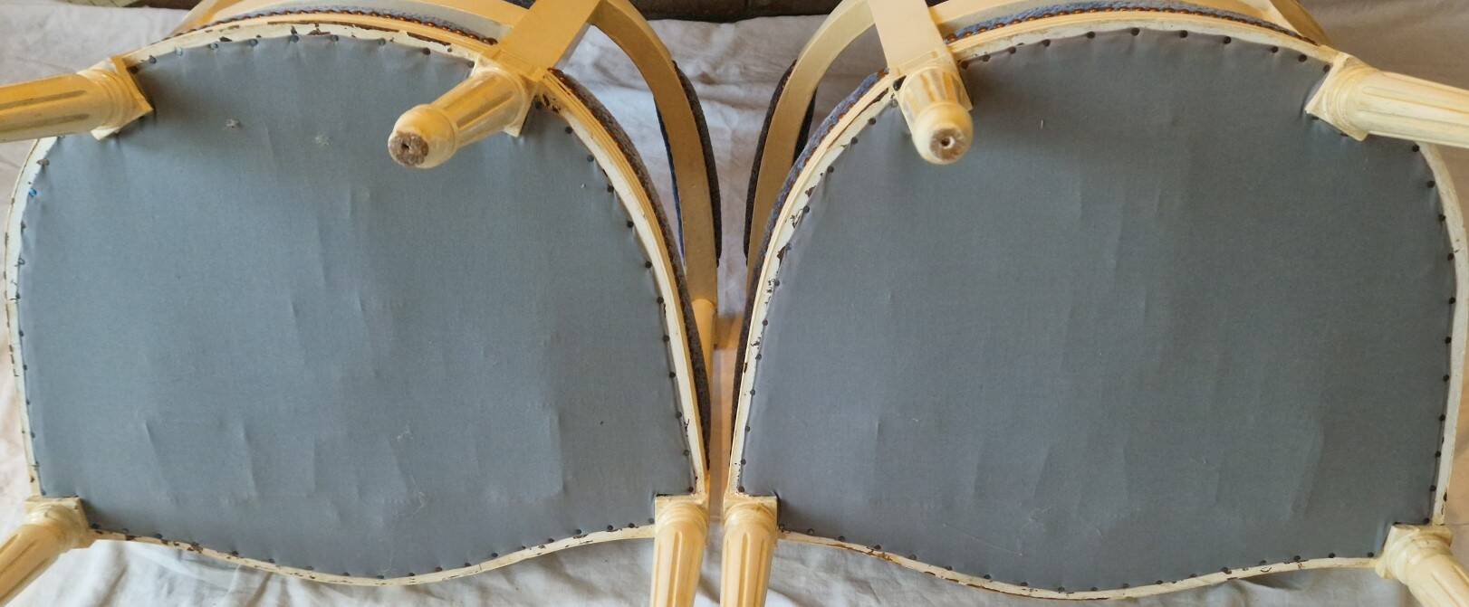 Pair of Louis XVI cabriolet armchairs in cream and blue French elegance late 19th century