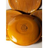 Ten plates in Salins slip with braided patterns 50s