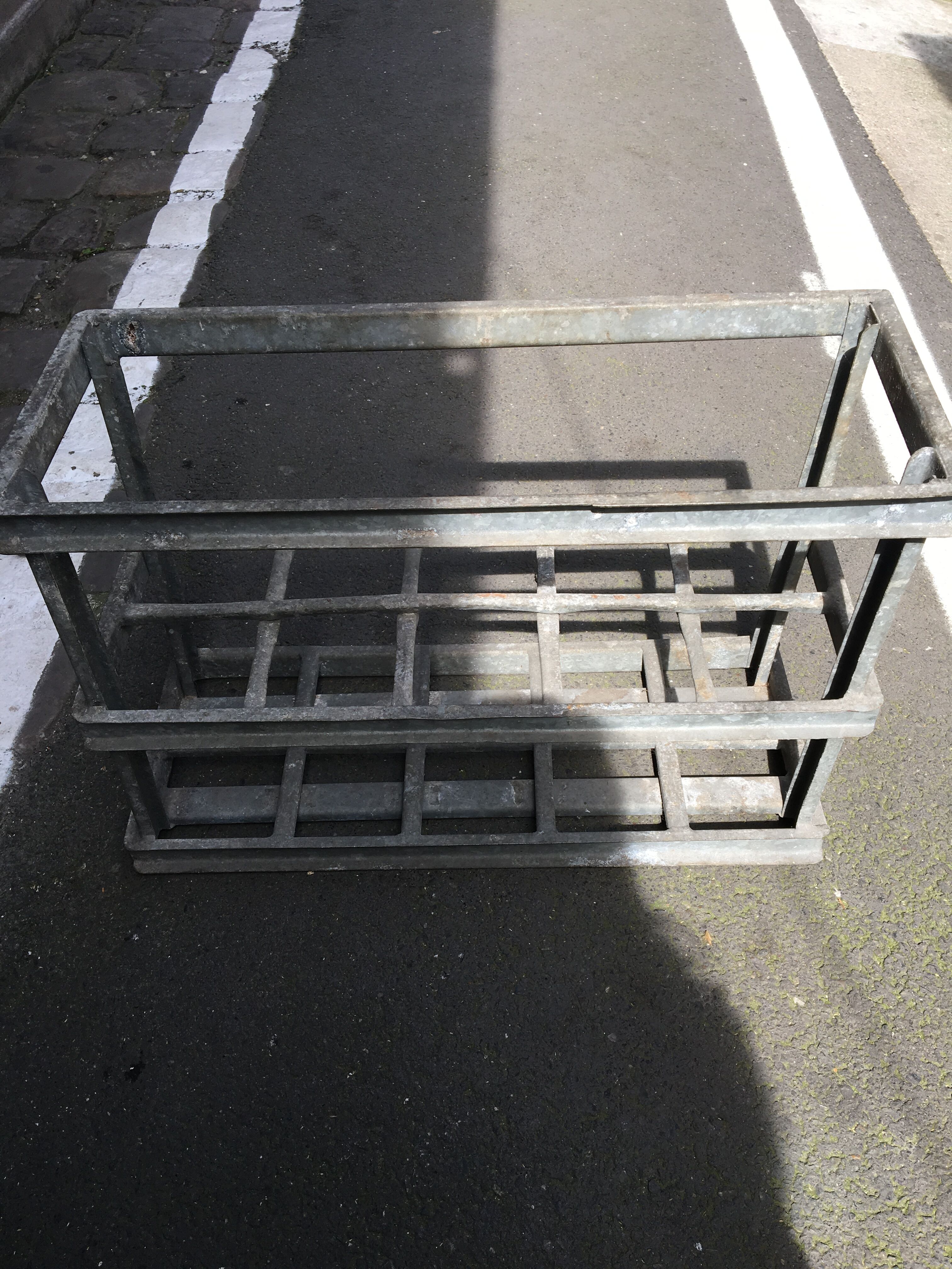 Old bottles in rectangular zinc locker