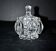 Thick moulded crystal sugar bowl with a beaded and medallion design.