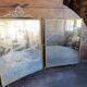 Antique French gilt metal triptych vanity mirror with floral crest