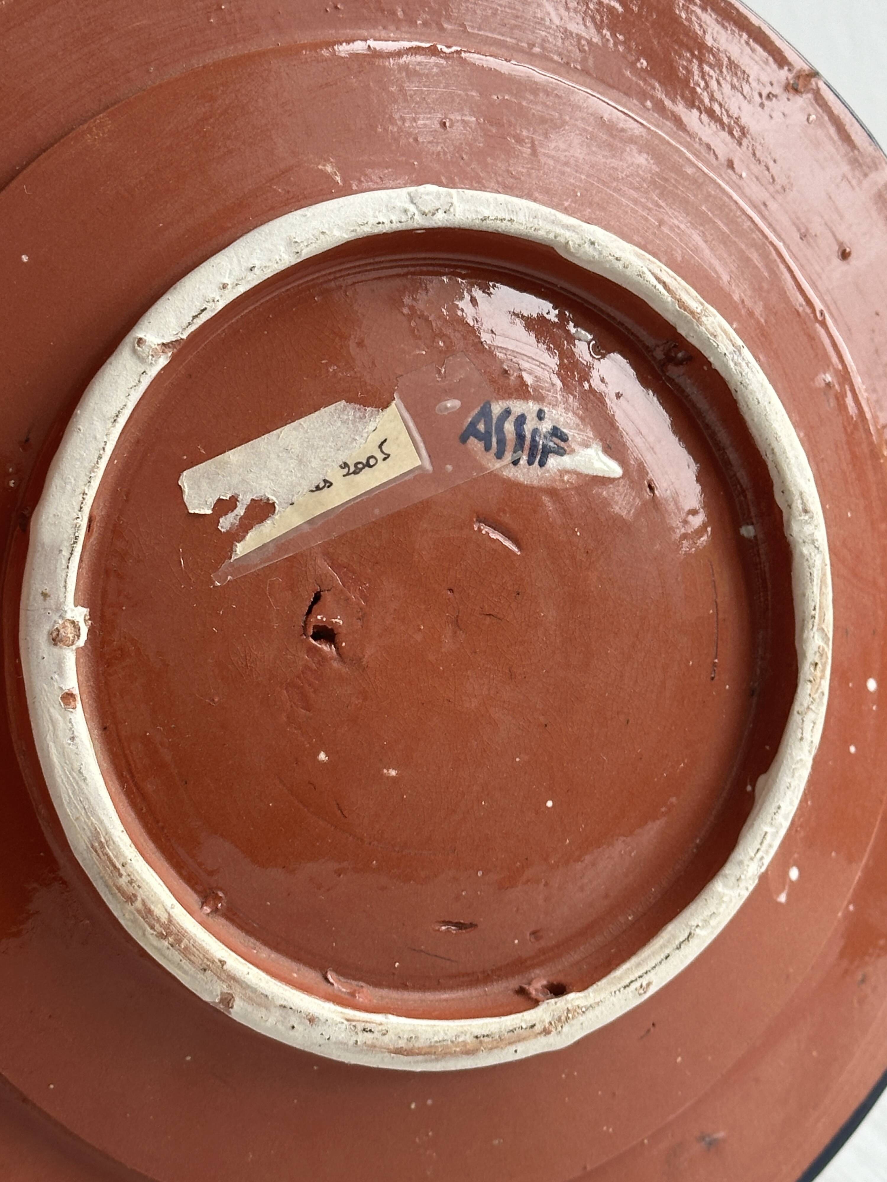 Raised dish, ceramic plate with blue and white patterns.