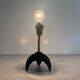 Pair of mid-century bedside lamps in brass and black metal, 1960, Italy.