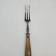 Set of silver-plated leg of lamb handles and fork, with horn handles.