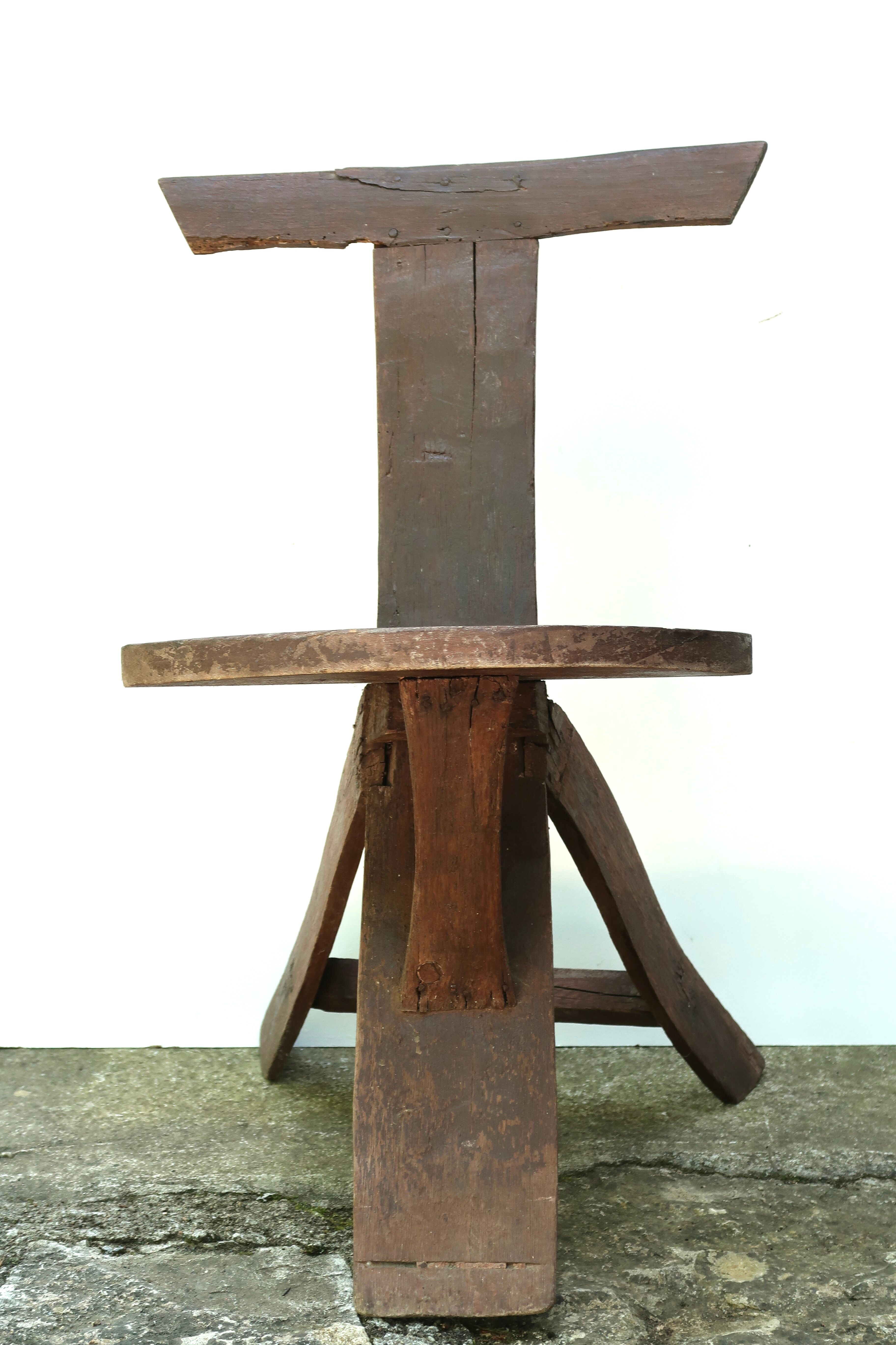 Regionalist wooden tripod chair