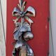Large three-light wall sconce in silver wood with fruit decoration.