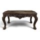 Louis XV coffee table in carved walnut with a gilded leather top.