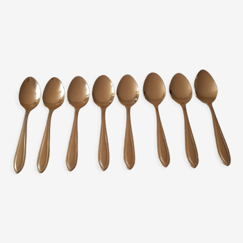 Small golden metal spoons