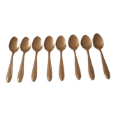 Small golden metal spoons