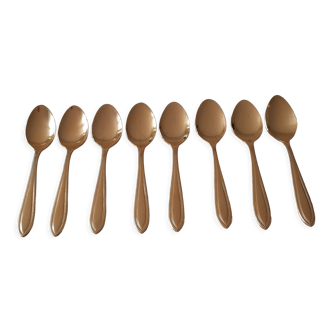 Small golden metal spoons