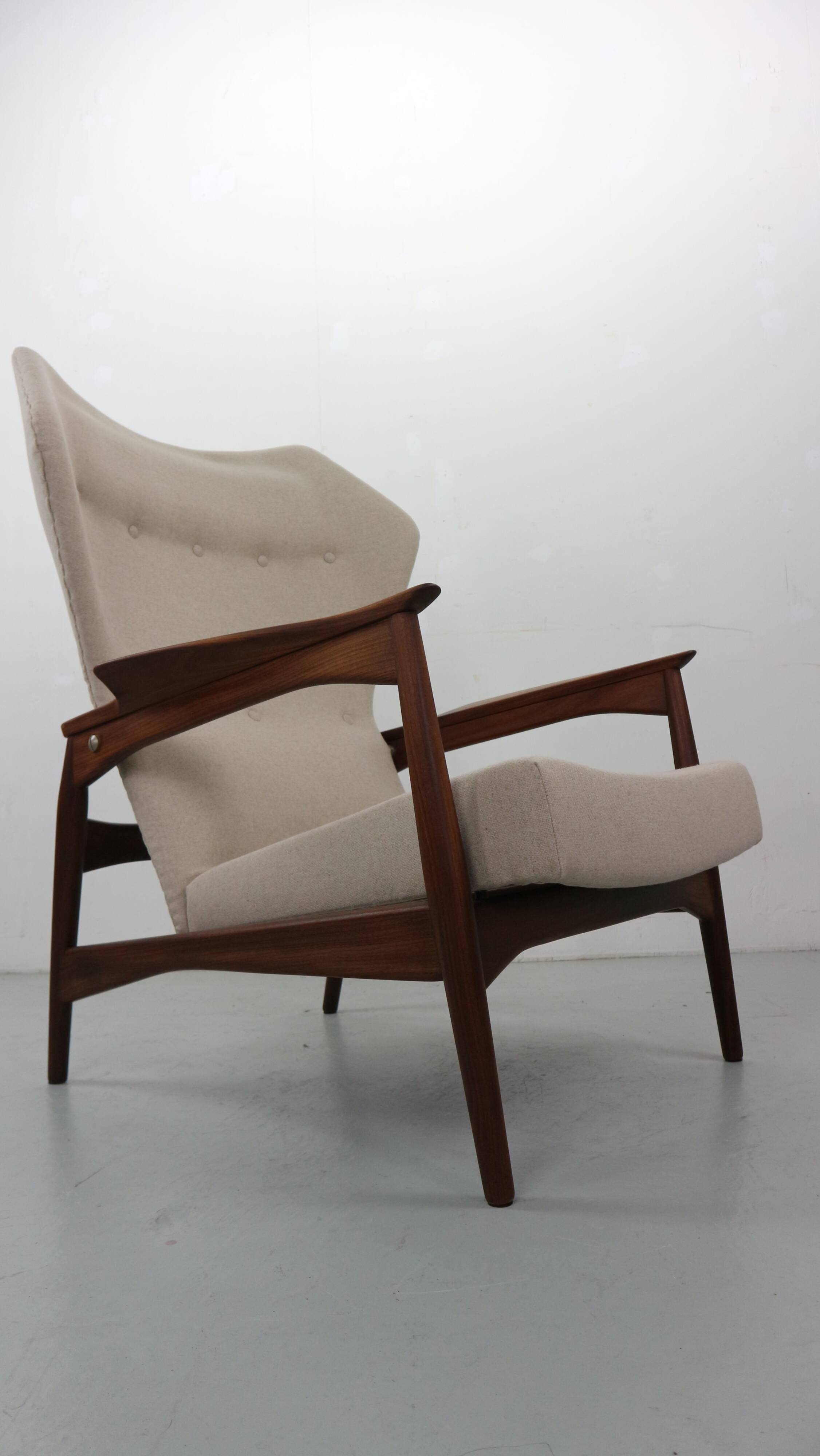 Danish adjustable wingback lounge chair in teak by Ib Kofod Larsen
