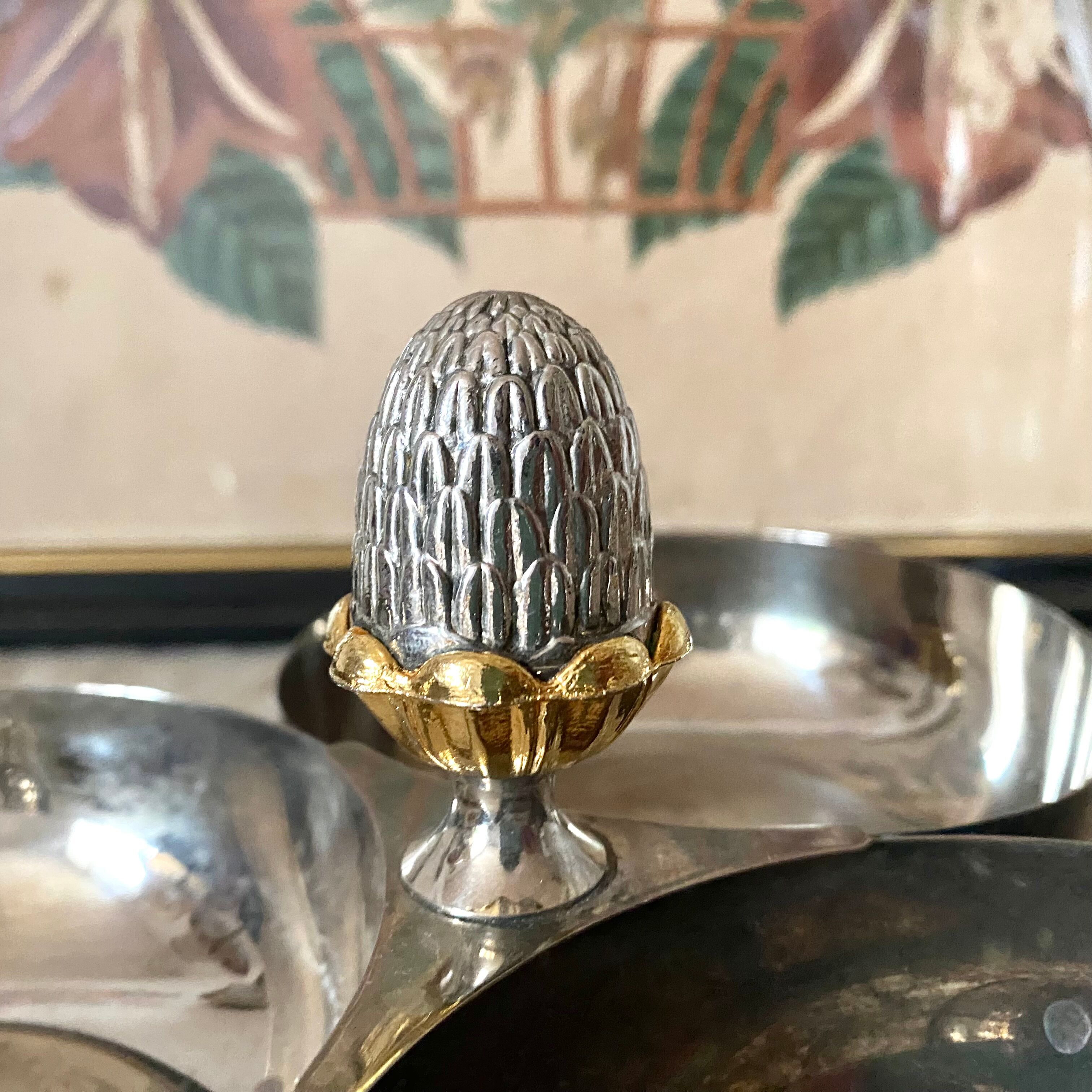 Servant in silver metal pine cone