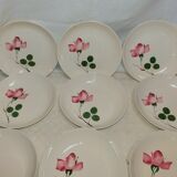 9 hollow plates caps in faience with decor of a rosebud