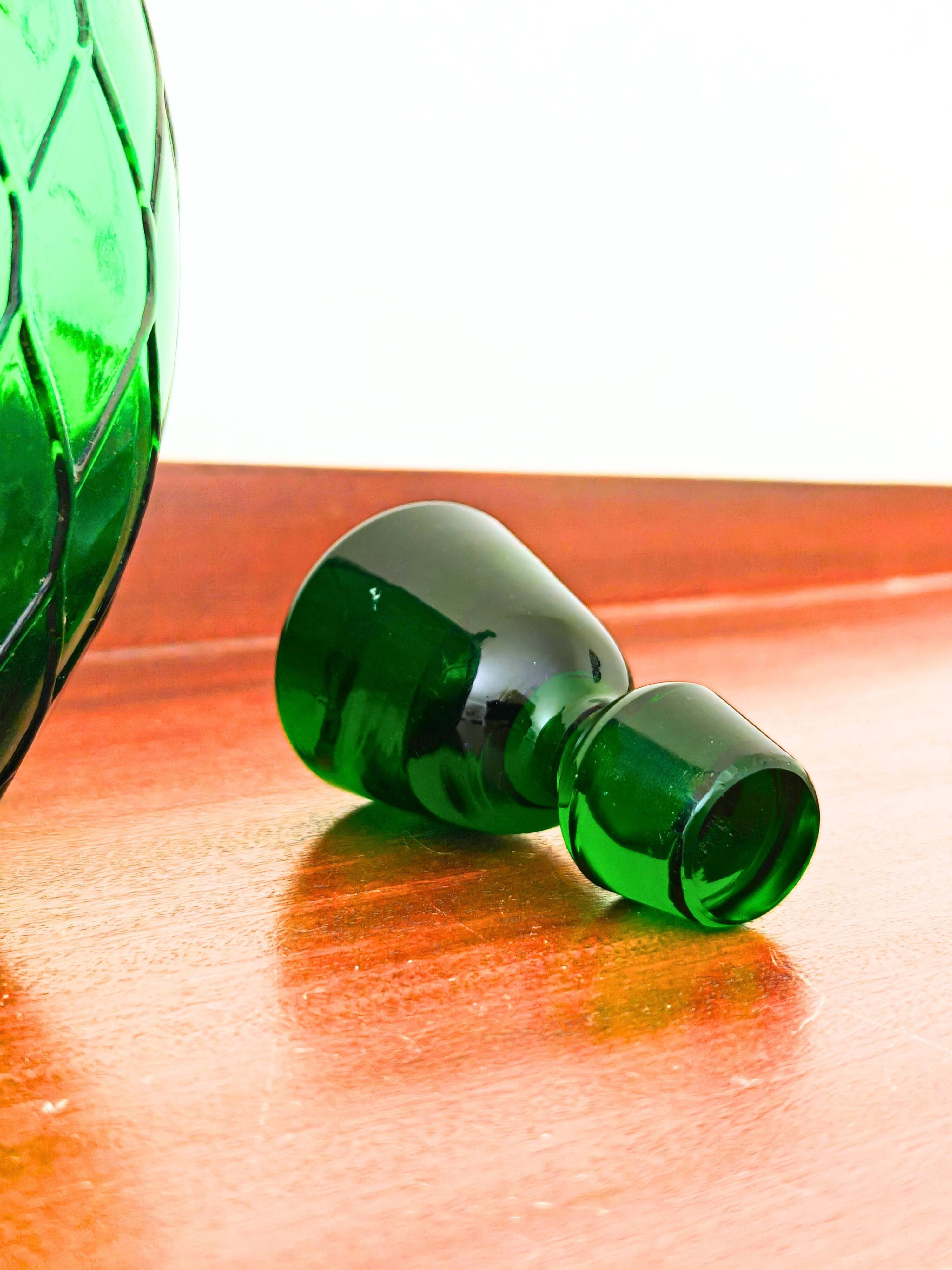 Italian carafe Empoli in iridescent green with diamond pattern.
