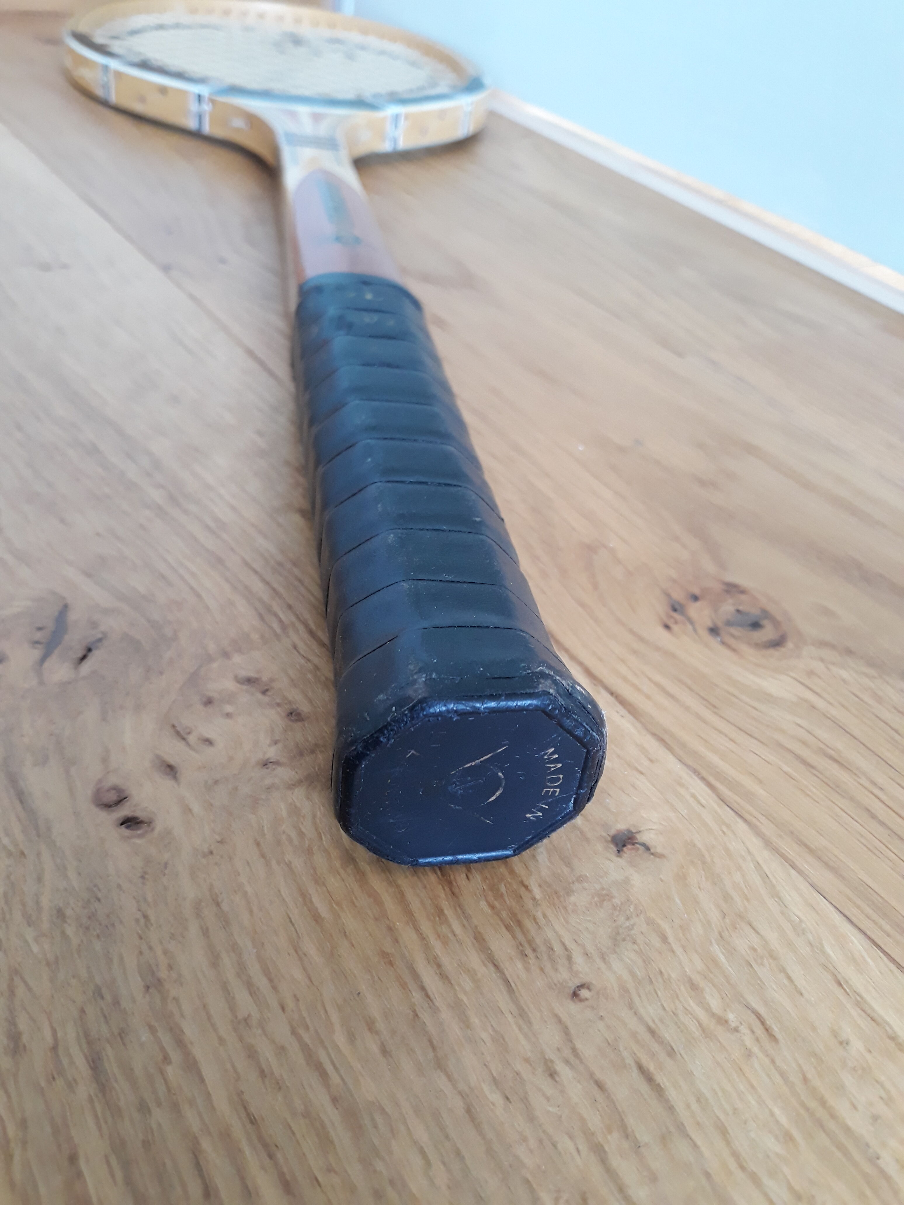 Wooden Dunlop tennis racket with its cover