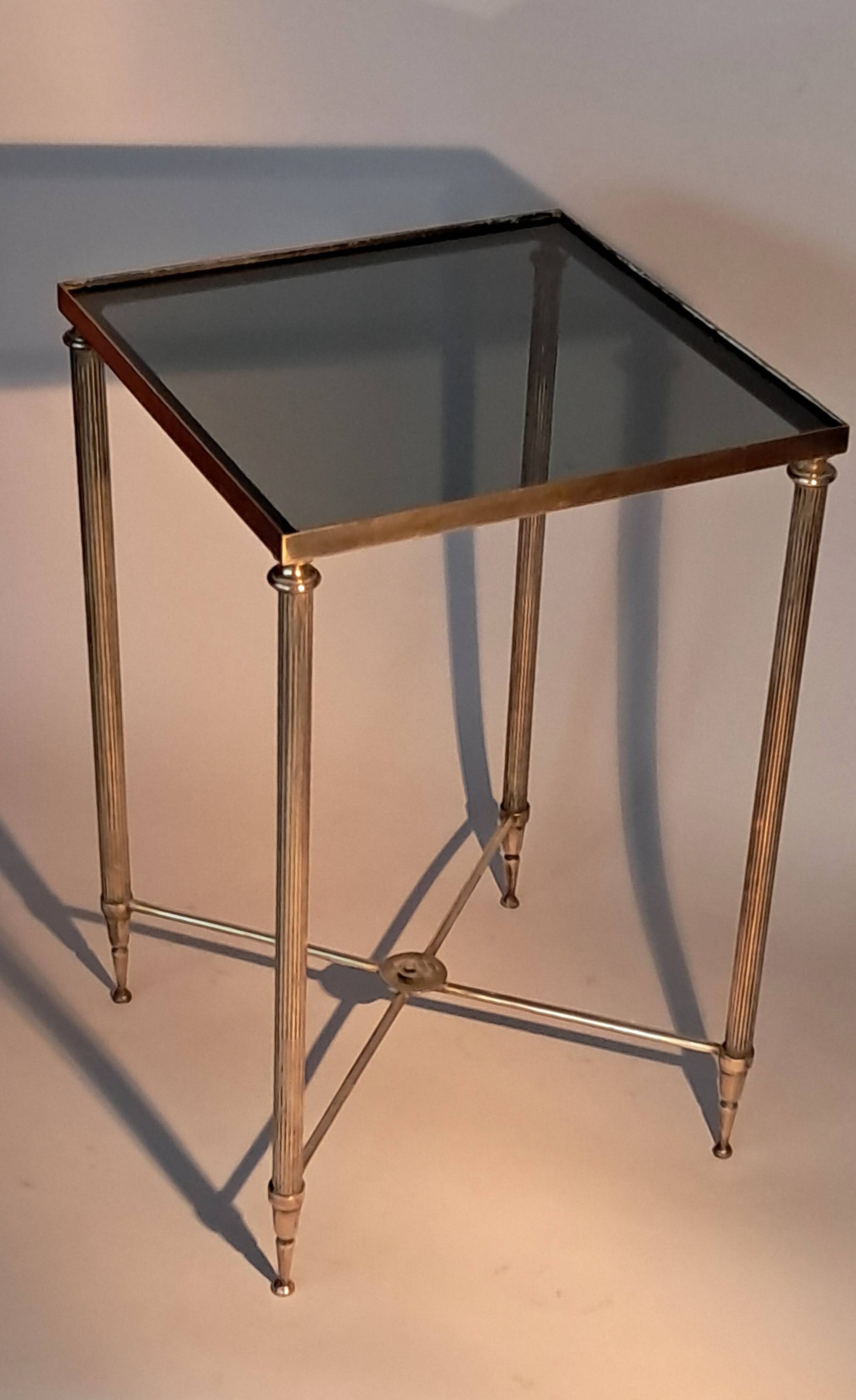 Gold brass side table in neoclassical style, circa 1960.