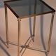 Gold brass side table in neoclassical style, circa 1960.