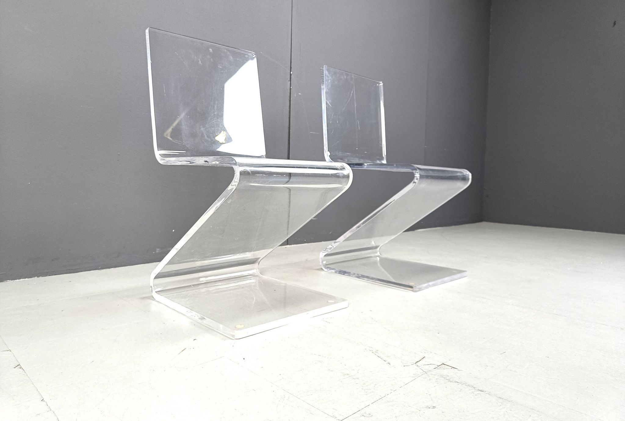 Pair of lucite zigzag dining chairs, 1980s
