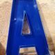 Letter A sign in vintage blue plexiglass