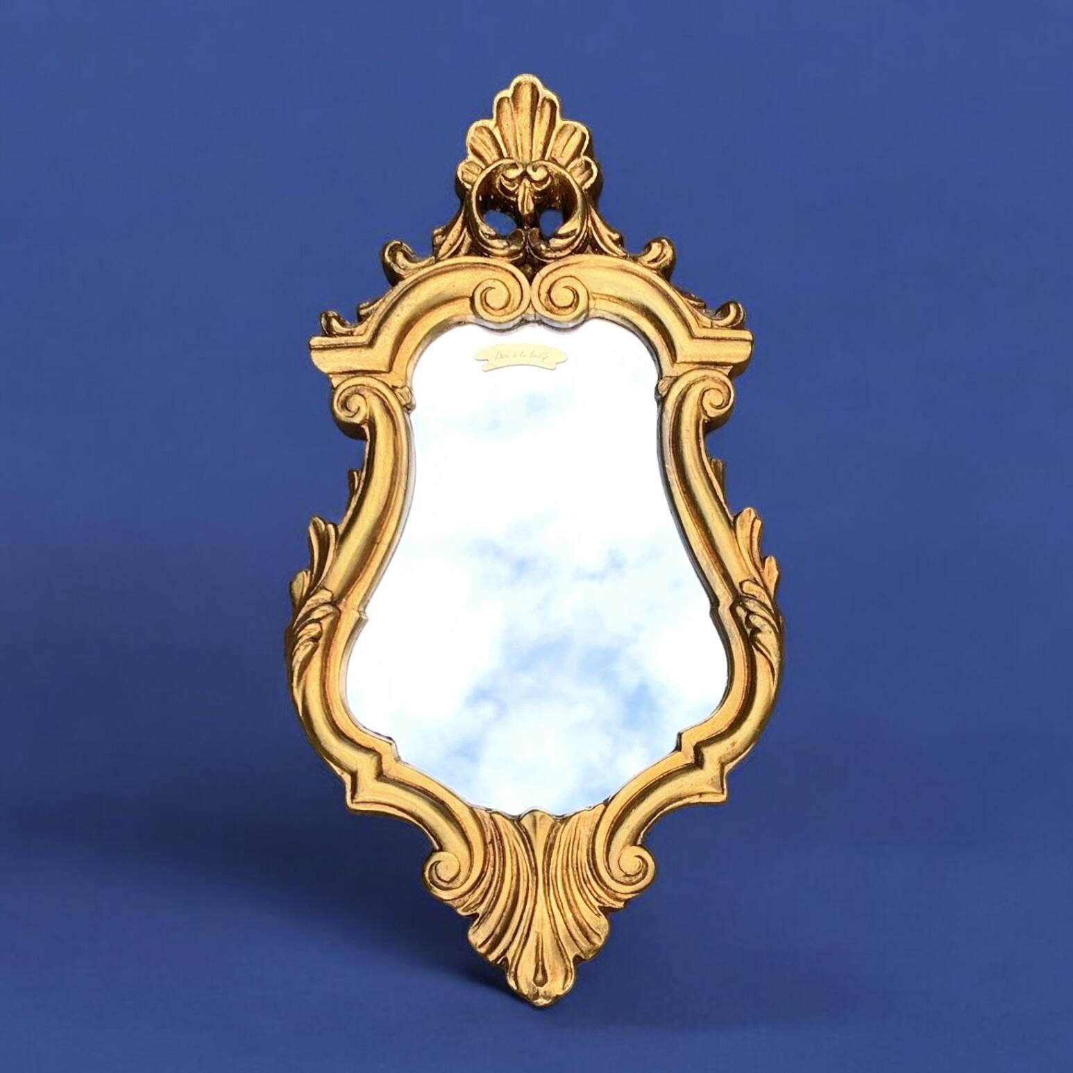 Antique wall mirror in gold leaf resin