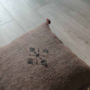 Moroccan brown cushion with cotton pompom