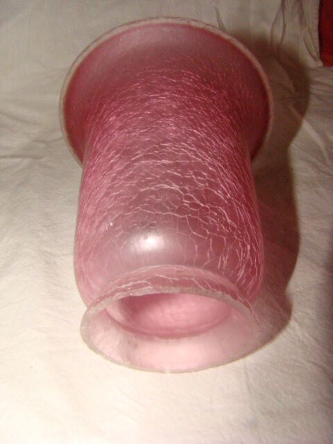 bronze bedside lamp with a pink cracked glass shade