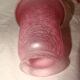bronze bedside lamp with a pink cracked glass shade