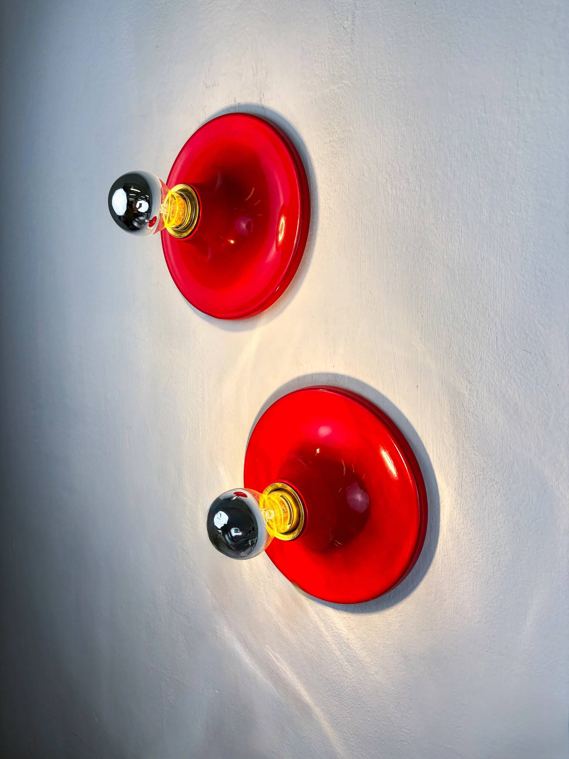 Pair of red Targetti Sankey sconces, 1970s, Italy