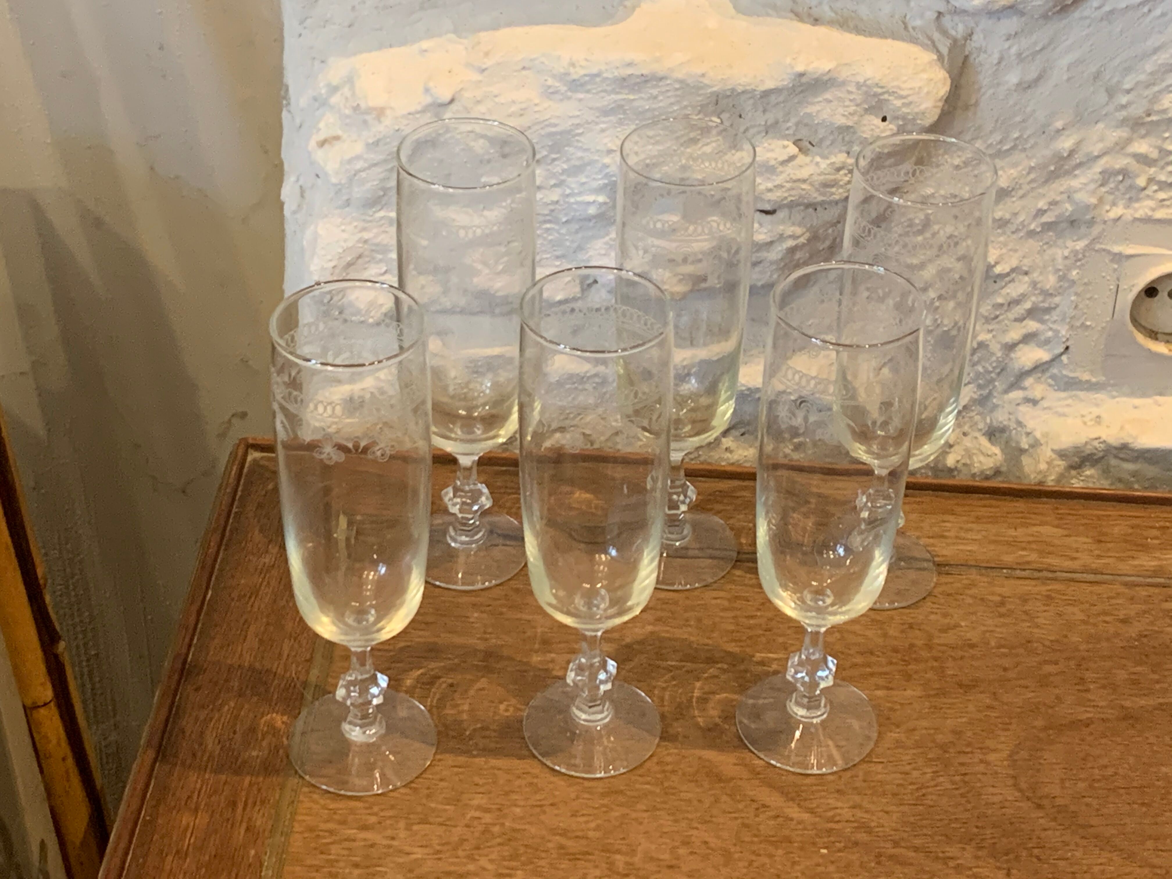 6 chiseled champagne flutes on vintage floral frieze pattern