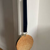 Vintage witch's eye curved mirror hangs velvet ribbon