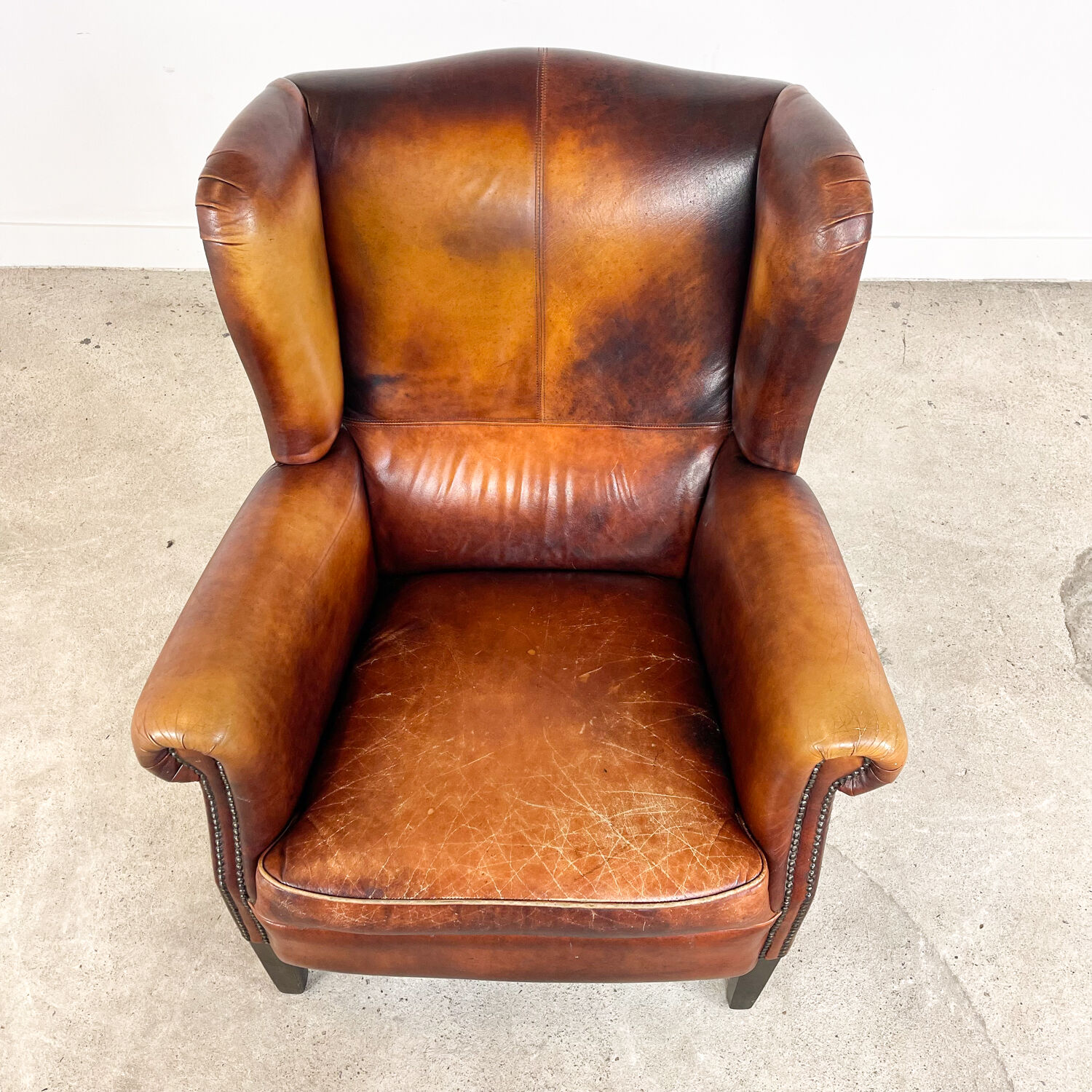Vintage sheep leather wingback armchair Goor