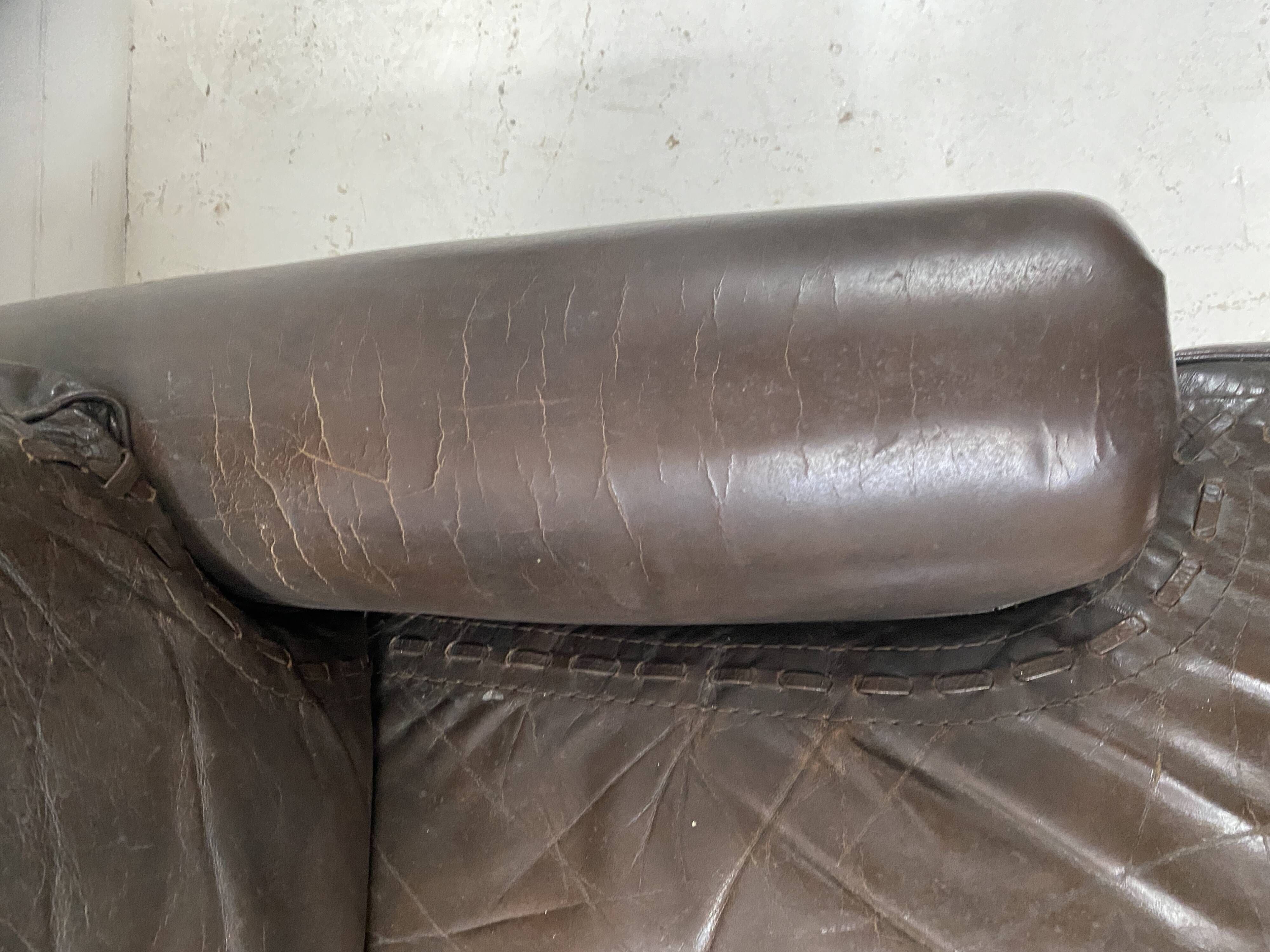 Pair of vintage brown leather armchairs from the 1970s.