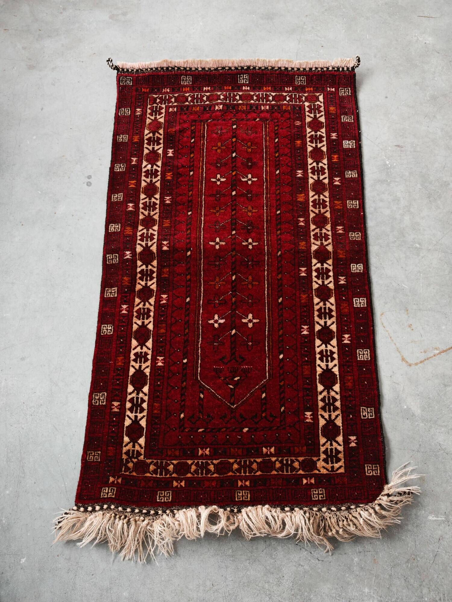 Vintage Afghan tribal prayer rug, hand-knotted from the 1950s.