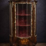 Curved display cabinet in Louis XV style with precious wood marquetry and gilded bronze.