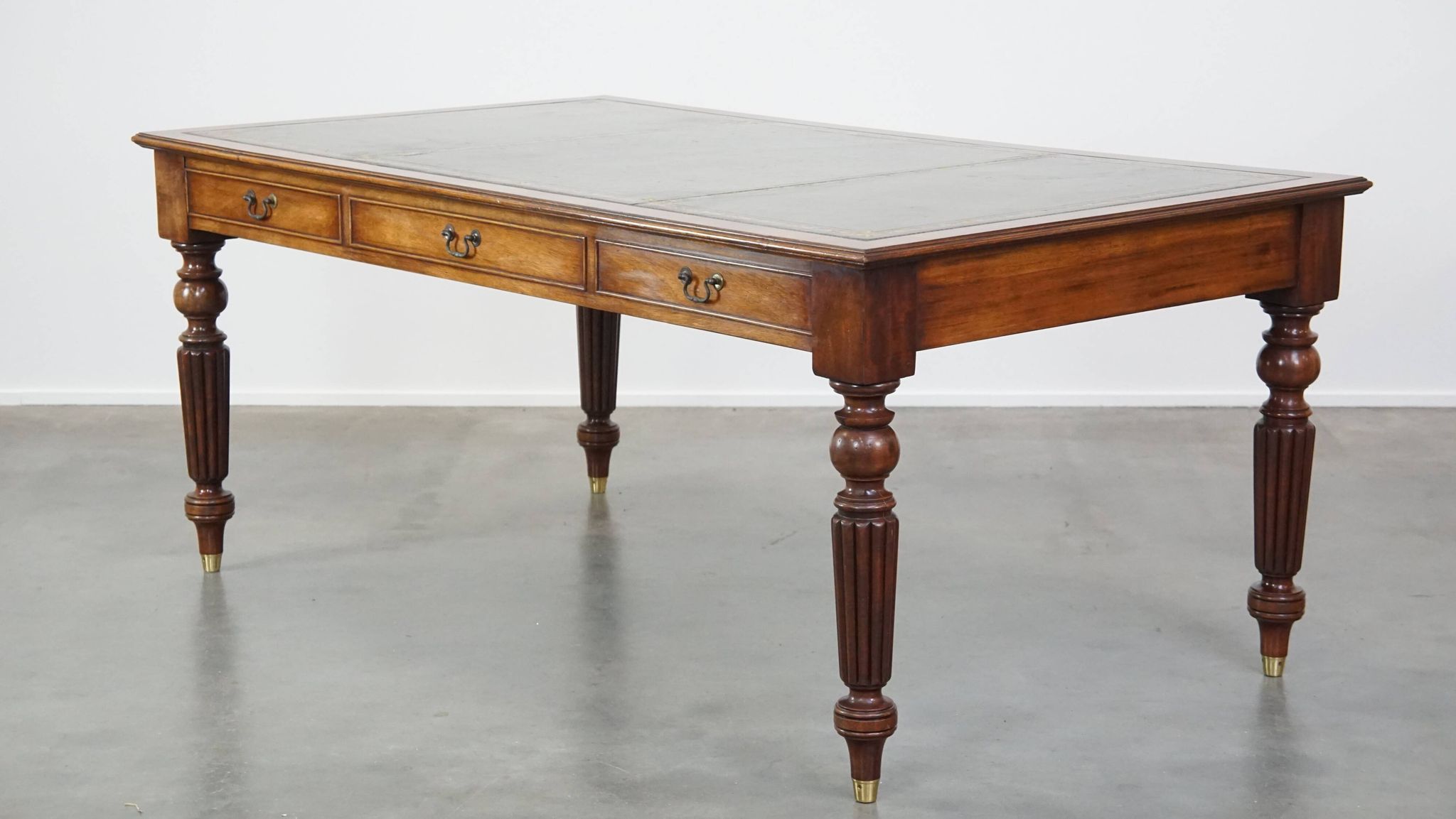 Large writing desk with green leather top, elegant legs and 3 English style drawers