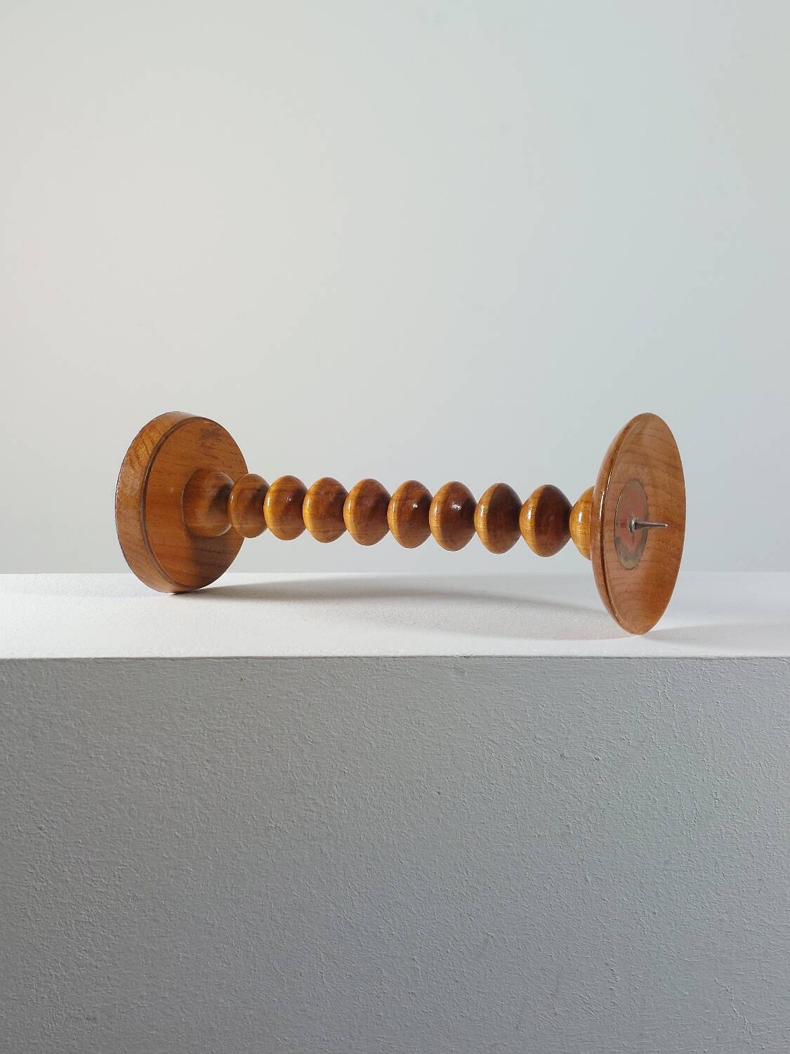 Vintage mid-century wooden candlestick, spool decoration from the 1970s.